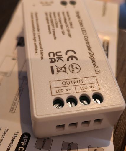 Zigbee light controller with 2 V- and 2 V+ terminals.